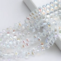 Macro shot of 6x9mm teardrop glass beads with iridescent electroplated finish for DIY crafts - 100 Pcs/Pack / Imported Colorful