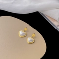 Vintage heart shaped pearl earrings in gold finish set on elegant silk fabric background - [XKE0291] White Shell Heart Studs Gold
