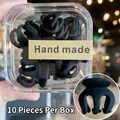 Detalle de 10 mini pinzas para el cabello negro mate en una caja con etiqueta manual - 10 Unidades/Caja / Negro