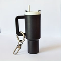 Black mini tumbler keychain with white lid and straw, featuring a silver metal carabiner - Black