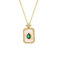 Macro detail of rectangle gold necklace featuring pear-cut emerald and sparkling zircon accents - Water Drop Green Zirconia Necklace