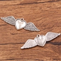 Silver winged heart pendants in metal alloy finish for DIY jewelry and accessories - 27B2-12 Winged Heart