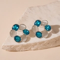 Detail of vintage flower stud earrings with opal and blue crystal on stone base - Blue Geometric Studs / Silver Base Blue Cat's Eye