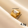 Detailed macro shot of a gold square ring with white oval resin and sunburst texture - Gold-White Enamel