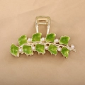 Elegant gold ginkgo leaf hair claw with green enamel and white pearls on fabric background - Green Ginkgo-YZAP45-3
