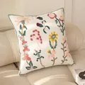 Beige embroidered cushion with floral and lizard patterns and green braided edges - Flower Lizard