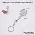Mini alloy tennis racket keychain, 7.7cm length with detailed mesh texture and grip - Keychain style / Silver