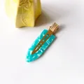 Macro shot of mint green marble acetate hair clip with polished gold metal grip detail - 33# Acetate 7cm Seamless Clip