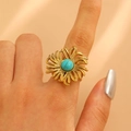Vintage golden sunflower ring with turquoise stone inlay on a silky background - Gold (9123)