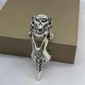 Close-up of a silver dragon armor ring with skull details and rhinestones on a jewelry box - Type F-Skull Claw Articulated Ring