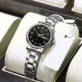 Close-up of quartz watch with black sunray dial and silver stainless steel strap - Silver Strap Black Dial Women's Model