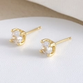 Classic 18K gold-plated four-prong stud earrings featuring clear round cubic zirconia - Gold White