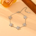 Silver stainless steel bracelet with five small floral charms and white inlay details - Steel Color Five Petal Flower Bracelet (N605)