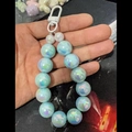 Light blue iridescent beaded keychain featuring large round pearls and a white carabiner - Light Blue AB