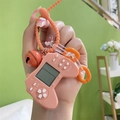 Orange mini Tetris handheld game console keychain with silicone strap and bell charm - Orange