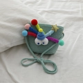 Mini light green woven straw bag for girls with colorful pompoms and blue hat decor - Lake Green
