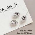 Macro-opname van 10x14mm zilveren harskralen met een hoogglans gepolijste afwerking - 3# (10x14mm)