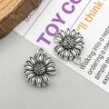 Antique silver finish sunflower alloy pendant with detailed petals and vintage texture - Antique Silver Sunflower Charm