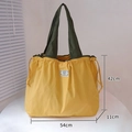Eco-friendly yellow foldable shopping bag with green straps and 54cm large capacity size - XL Ginger