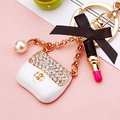 White crystal handbag keychain with black silk bow, pink lipstick and pearl pendant - White Enamel Handbag