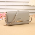 Taupe multi-functional crossbody phone bag with gold zipper and stylish metal bar - Gray
