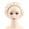 Detailed close-up of champagne satin bonnet with elastic ruffled edge on head model - One Size / Champagne