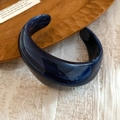 Detailed view of dark blue marbled resin bangle with wide geometric curved design - Wide Geometric Curve Open / Ink Blue Marble
