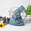 Detail of a Japanese style cotton linen knot bag featuring ethnic geometric patterns - Blue Ethnic Style
