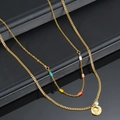Double-layered gold stainless steel necklace with colorful beads and a round pendant - S124 Double Layer Necklace
