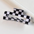 Detail of medium black and white checkered acetate hair claw clip on clean background - Black White Small Grid Rectangular Claw