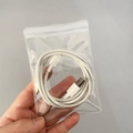 Portable white USB cable stored in a small transparent PVC self-sealing storage bag - 30 Micron 9x13cm Resealable / 100 Pcs/Pack