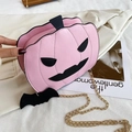 Pink pumpkin shaped Halloween crossbody bag with golden chain strap and bat charm - Pink