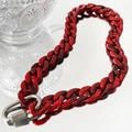 Detailed macro view of deep red marble texture acrylic links with silver metal buckle - Red Necklace