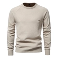 Detailed close-up of beige waffle knit fabric and raglan sleeve stitching on men sweater - Apricot