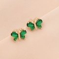 Elegant gold butterfly stud earrings with sparkling green zircon crystals on pink silk - Green