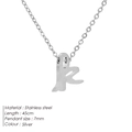 Halskette aus silbernem Edelstahl mit kleinem Buchstaben-k-Anhänger auf Weiß - Kleinbuchstabe k / Stahlfarben