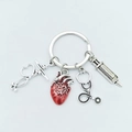Nurse medical keychain with silver syringe stethoscope and red enamel heart charms - 4-Piece Medical Set - Red Anatomical Heart