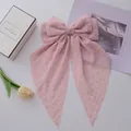 Pink chiffon bow hair clip with long streamers and textured polka dot pattern - Pink