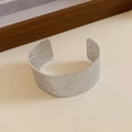 Minimalist silver open cuff bracelet with hammered texture and pleated metal design - Silver Hammered Wide Cuff Style