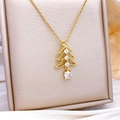 Gold Christmas tree pendant necklace with white zircons on a champagne velvet box - Hollow Christmas Tree Charm / Gold
