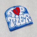 Detailed top-down view of blue beanie with TOP TIER knit text and red heart graphic - One Size / Sky Blue