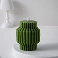 Artistic green pillar candle with unique vertical wave patterns and a matte finish - Dark Green