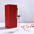 Elegant rose inside a glass champagne flute with a red luxury gift box nearby - Red Rose Champagne Glass (Gift Box)