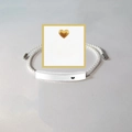Detail of hand-woven bracelet with Just Breathe engraved curved metal plate on card - Just Breathe Silver Bar White Rope With Card