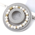 Elegant pearl bracelet with gold rhinestone spacers on a 14cm wooden display tray - Flocked Plastic / Grey Sizing Tray (14cm)