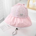 Close-up of pink sun hat featuring delicate hollow lace flowers and a sweet bow knot - 52cm (2-5 Years) / Pink