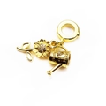 Detail of gold sunflower and watering can charms with micro-pave zircons on a white background - Garden Sunflower/Watering Can