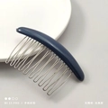 Detail of blue non-slip hair comb with metal teeth and plastic handle on a plate - Navy Blue