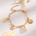 Gold charm bracelet featuring white shells and starfish pendant for beach vacation - KC Gold Shell Starfish Bracelet (8459)