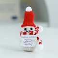 Positive Potato crochet doll with red knit hat and scarf holding motivational card - Santa Hat Potato Off-White